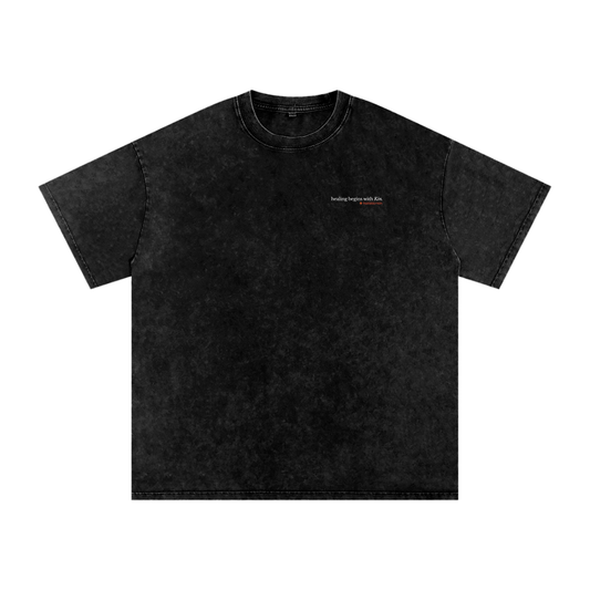 Black t-shirt with 'healing begins with Kin' and the Holistic+Kin logo on a white background