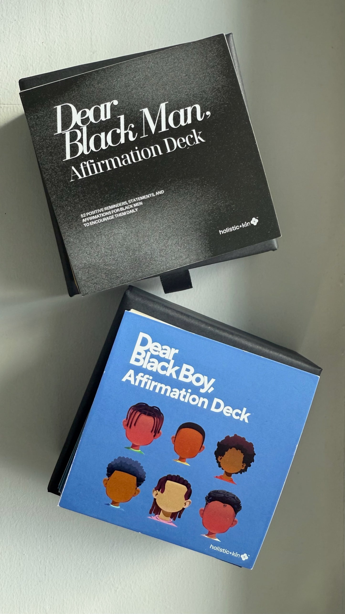 Two affirmation decks titled 'Dear Black Man' and 'Dear Black Boy' on a light gray background.